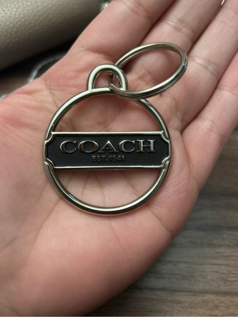 COACH charm and Silver Round Logo Keyring